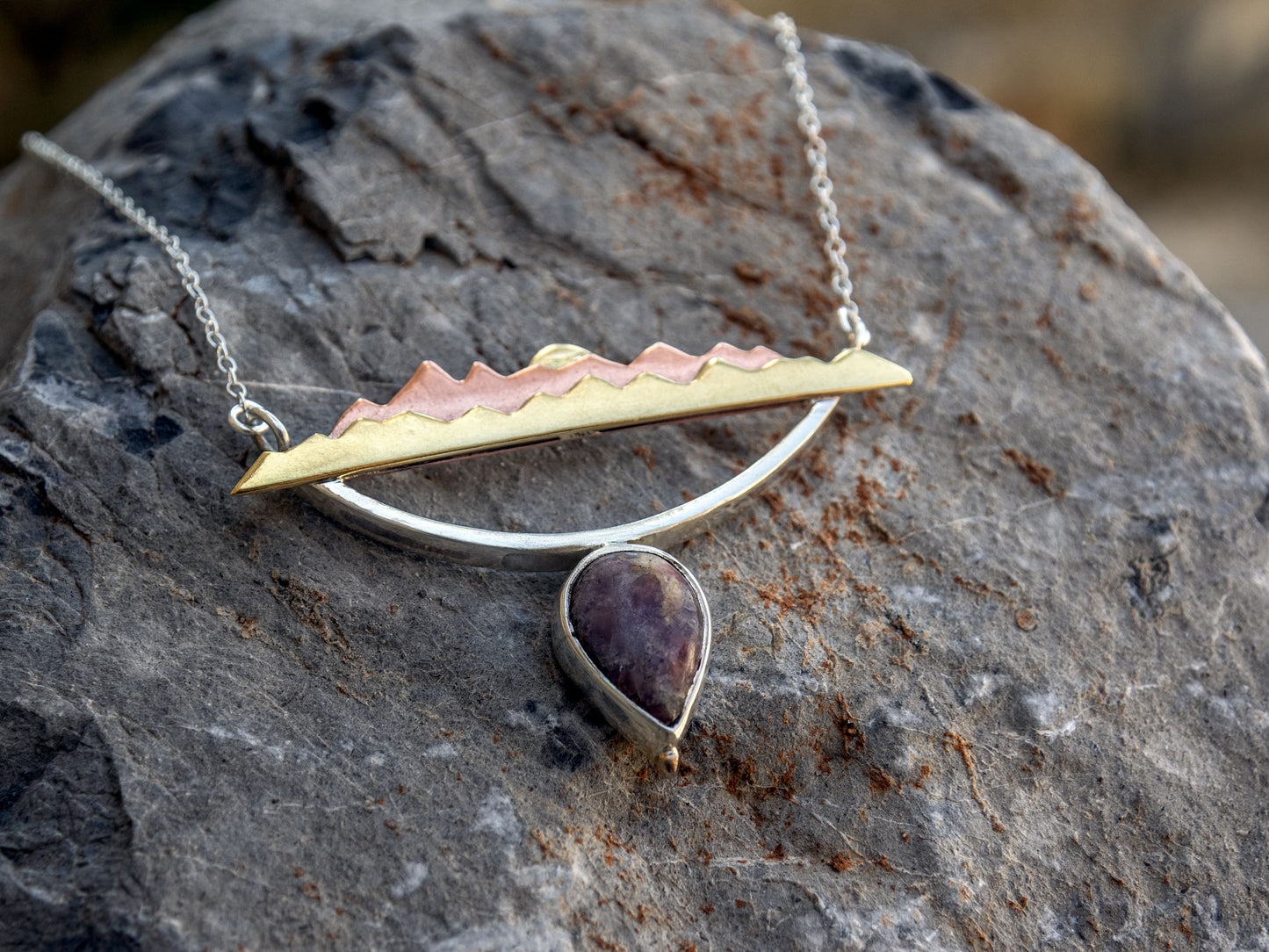 Mixed metal necklace with a Tourmaline stone and a mountain scene