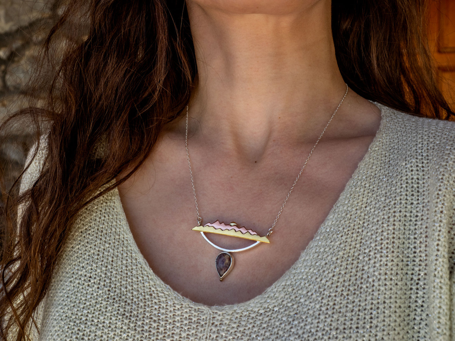 Mixed metal necklace with a Tourmaline stone and a mountain scene