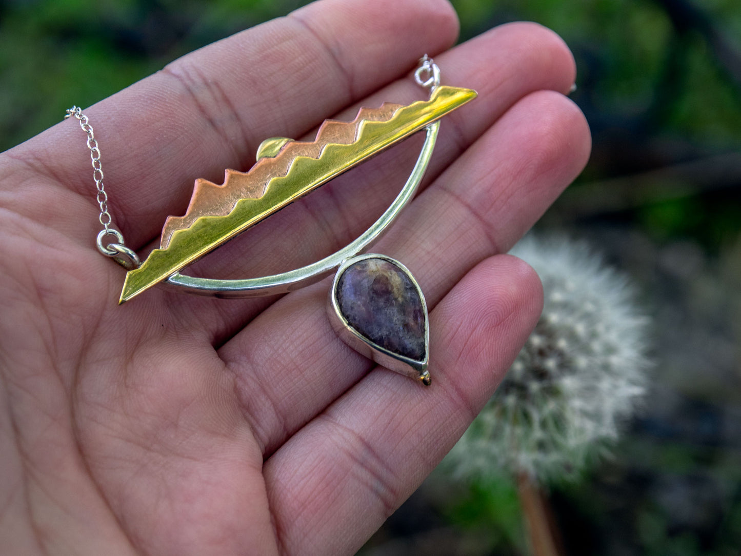 Mixed metal necklace with a Tourmaline stone and a mountain scene